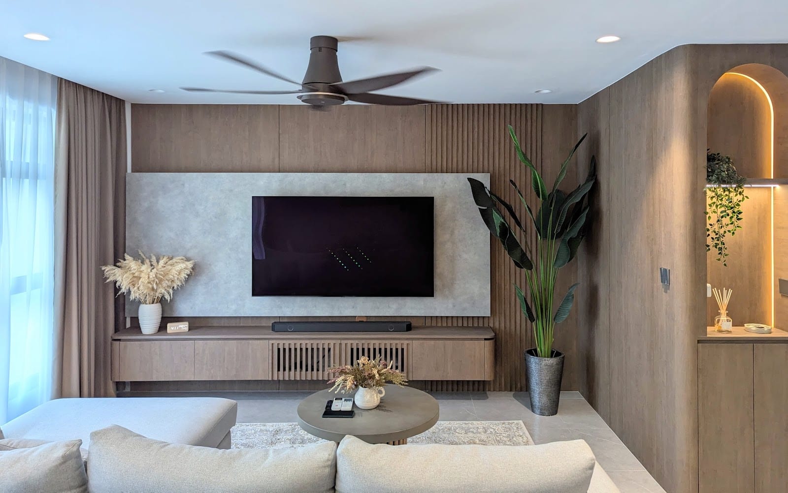 Scandinavian Japandi 5-room resale flat living room with custom archway and warm timber finishes by DCSG